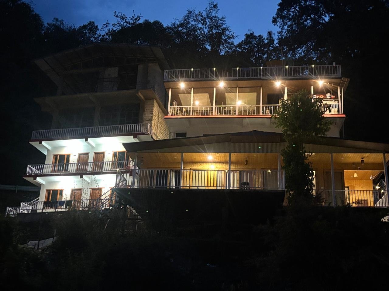 Hotel Snow View Chopta lit up at night